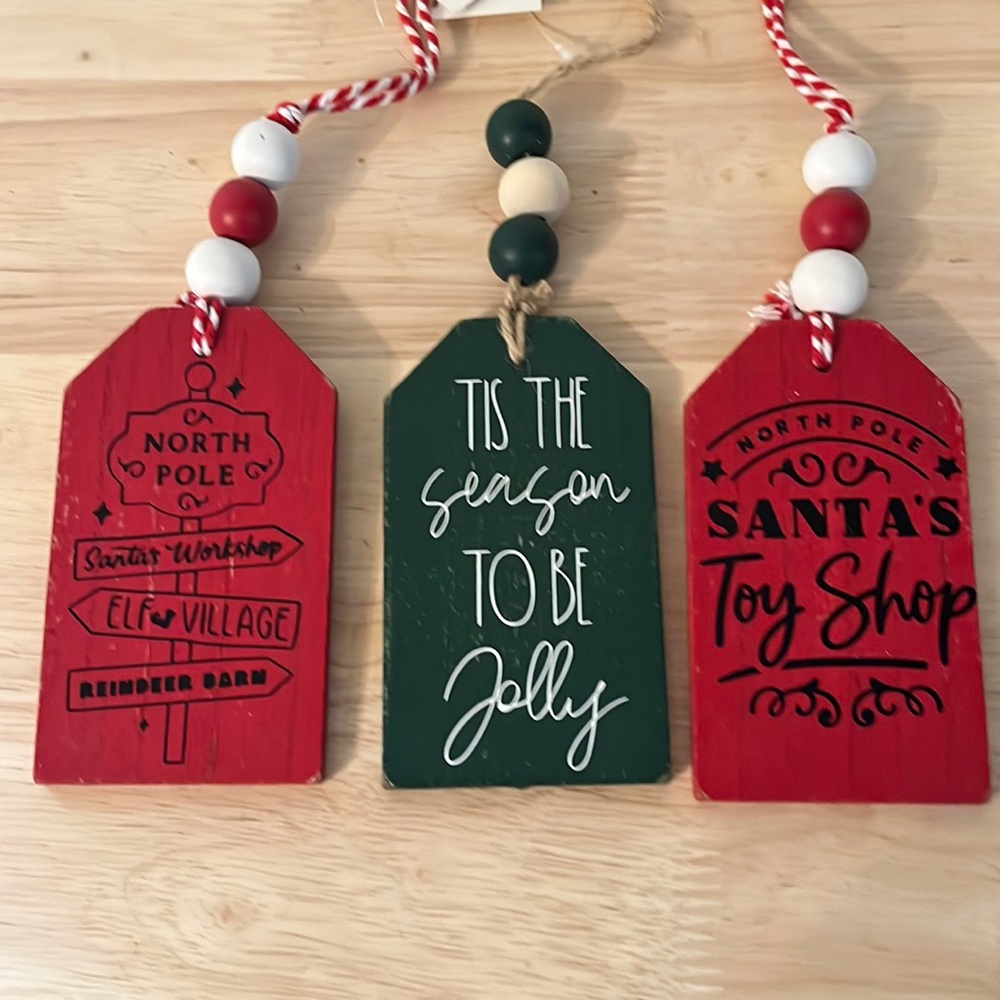 Set of three Christmas stocking tags with beaded hangers